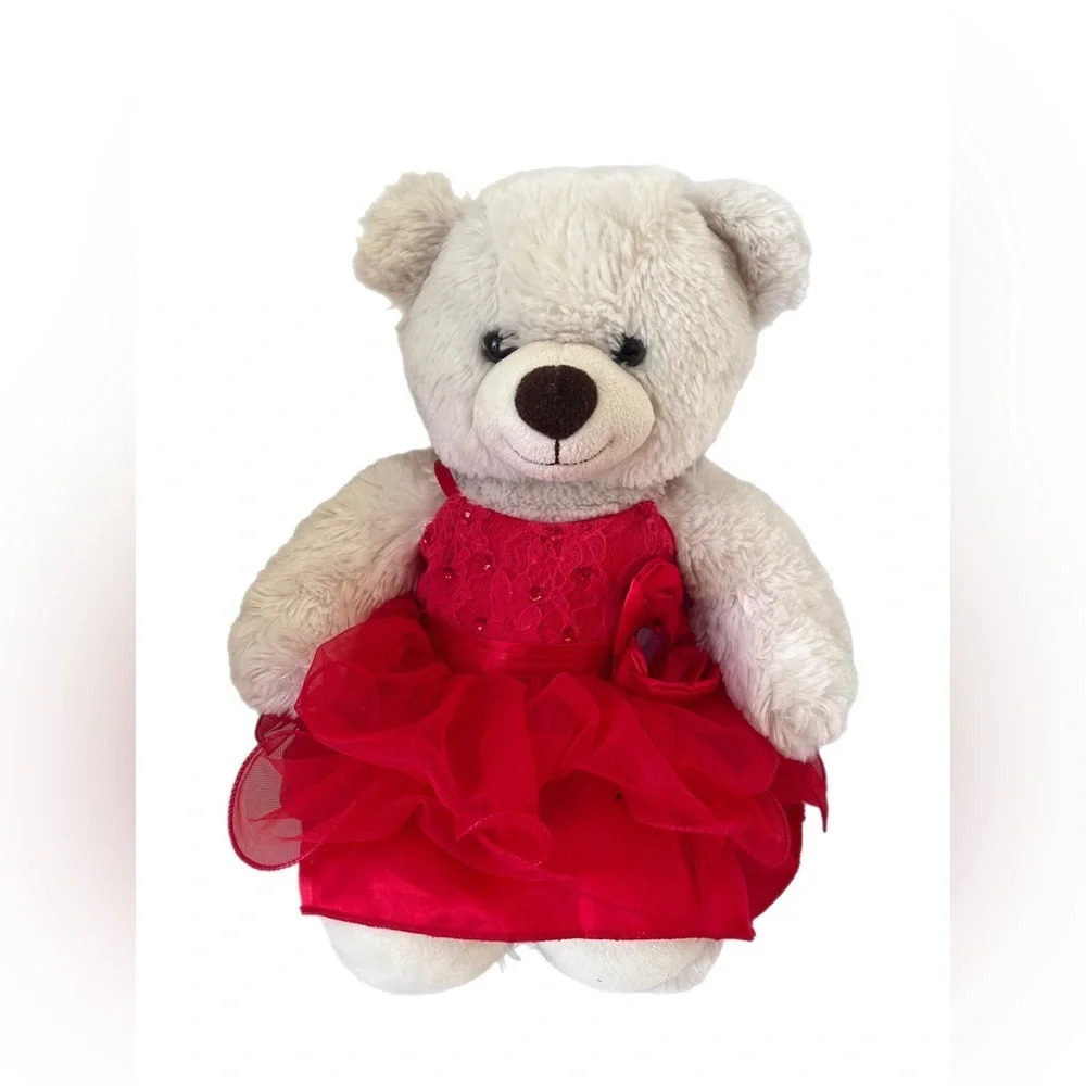 Build-A-Bear white bear with a black nose and a red dress.